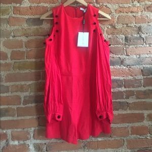 Alexis Asher romper  cold shoulder, w black poms